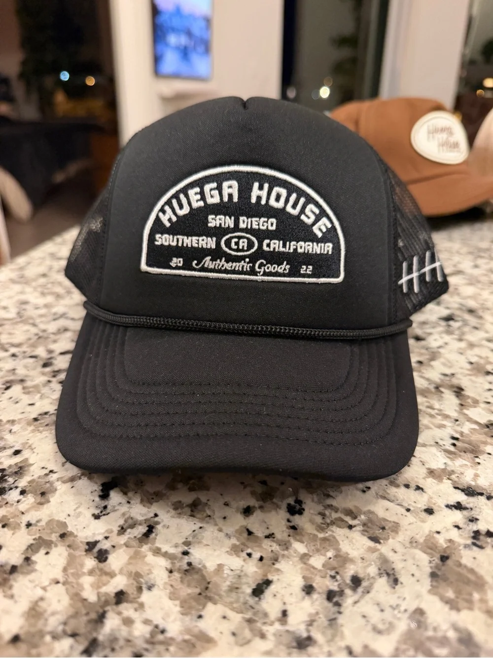 Huega House Black Trucker Cap with White Patch and Stitch Detail